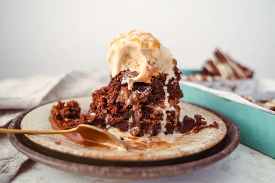 spoon dipped in brownies and ice-cream